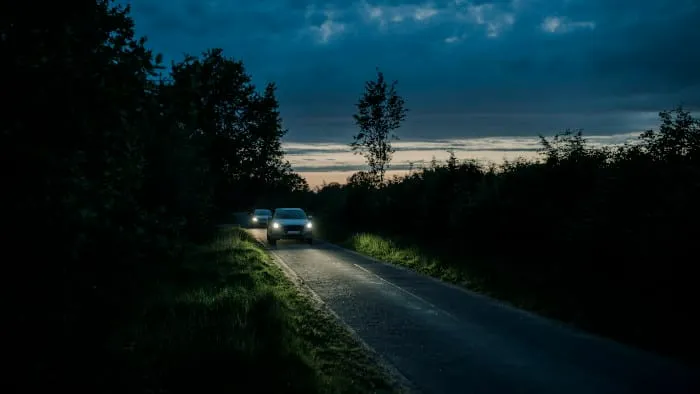road-front-two-cars.webp